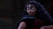 Gothel noticing Rapunzel's pet chameleon, Pascal trying to stop her, prompting her to kick the lizard away.