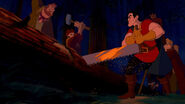 Gaston and his buddies having cut down a tree, in order to use its trunk to break into the castle.