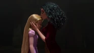 Gothel kissing Rapunzel's hair.
