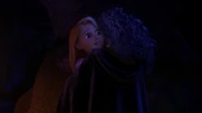 Gothel embracing a surprised Rapunzel.