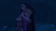 Gothel embracing and manipulating Rapunzel.