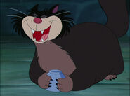 Lucifer laughing evilly at the mice's attempts to fight him.