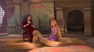 Gothel and Rapunzel sitting down together as Rapunzel begins singing the incantation.