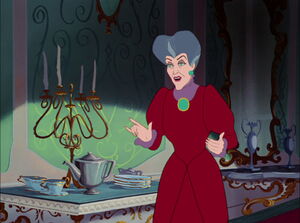 Lady Tremaine about to offer a cup of tea to the Grand Duke before he politely declines her hospitality.