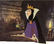 Rare production cel of the Evil Queen with a book of spells.