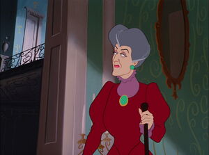 Lady Tremaine glancing at the door to the attic, making sure Cinderella is still trapped up there.