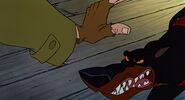 Oliver-co-disneyscreencaps.com-2123.jpg (219 KB) Roscoe nearly bites Fagin's hand when he tries to pet him.