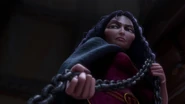Gothel raising her eyebrows when Rapunzel strikes a deal with her where she will give up her freedom if she heals Eugene.