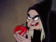 Queen Grimhilde satisfied that she can give the poisoned apple to Snow White without any interferences.