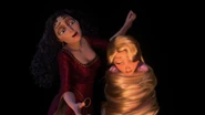Gothel having Rapunzel wrapped in her own hair.