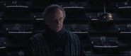 Palpatine addressing the Chancellor and the Senate.