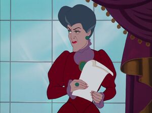 Lady Tremaine glancing at Cinderella when she says she wants to go to the ball.