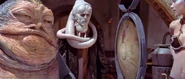 Jabba ringing a gong to start the race.