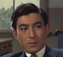 BijoToEkatai-Ningen1958DetectiveTominaga.png (476 kB) Inspector Tominaga (Akihiko Hirata) en El hombre H