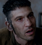 Grady 'Coon-Ass' Travis (Jon Bernthal) en Corazones de hierro.