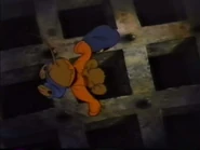 Fievels furry rear end is exposed as he looks in the drain.