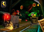 Diddy Kong and Krash battling on Mine Cart tracks as seen in the game Donkey Kong 64 for Nintendo 64.