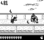 Diddy Kong running towards a Kruncha, as seen in the game Donkey Kong Land 2 for Game Boy.