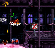 Squitter the Spider about to reach the No Cursor sign of the stage Krack-Shot Kroc, as seen in the game Donkey Kong Country 3: Dixie Kong's Double Trouble! for SNES.