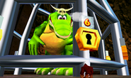 K. Lumsy in his cage inside the small prison island, as seen in the game Donkey Kong 64 for Nintendo 64.