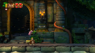 A Tutorial Pig celebrating the primates reaching his checkpoint stall, as seen in the game Donkey Kong Country: Tropical Freeze.