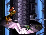 Diddy riding Winky, near a Kritter enemy.