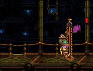 Dixie raises a purple Level Flag in Fire-Ball Frenzy.