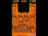 Donkey Kong swinging on a boulder.