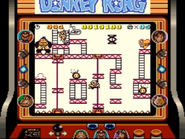 Mario moving through the stage 75m of the game Donkey Kong for Game Boy, as seen on the Super Game Boy for SNES.