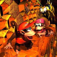 Artwork of Diddy and Dixie Kong pursued by a Zinger inside a giant hive.