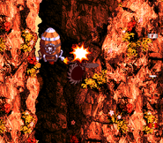 The Kongs in a Rocket Barrel going throughout Rocket Rush while defeating a Buzz.