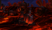 Three Kong head statues in the Volcano, as seen in the game Donkey Kong Country Returns for Wii.