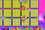 Bubbles using a charged attack against Donkey Kong during the Attack Battle event of the Jungle Jam modes, as seen in the game DK: King of Swing for GBA.