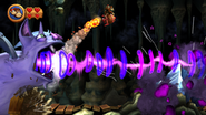 The Mega Squeekly fires a sonic beam at the Kongs (Wii version).