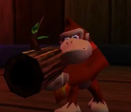 DK using his Coconut Gun in his "Busy Barrel Barrage" minigame.