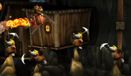 Mole Guards on the ground trying to hit the primates' Rocket Barrel with pickaxes.