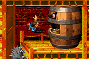 Kiddy and Dixie Kong throwing a Knik-Knak into Belcha's mouth as seen in the game Donkey Kong Country 3 for GBA. Notice the grinder added to the pit at the left edge of the stage in this game version.