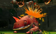 Donkey Kong delivering the final attack on Mugly's weak spot, as seen during a cutscene of the game Donkey Kong Country Returns for Wii.