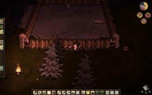 壁に囲まれた野外炉と冷蔵庫のキャンプ