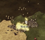 Bees still trying to pollinate the flowers even though they are on fire.