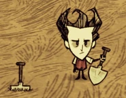 Wilson đang cầm Xẻng.