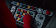 Red Guy pushing the machine's buttons