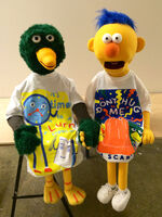 Duck and Yellow Guy wearing their own merchandise