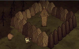 Dom świni otoczony przez bazalt