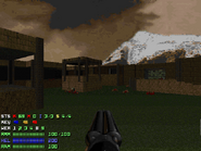 The Doomguy stands near the end of the level, looking toward the central tower.