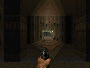 The initial view of Entryway. In the distance, two Zombiemen stand with their backs facing the player.