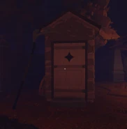 An outhouse with The Grimkeeper active, as seen by the resting scythe.