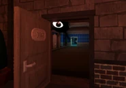 A door in The Hotel, but with one of Seek's eyes on it.