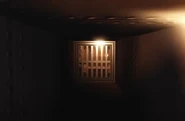 A player inside a vent in a Basement.