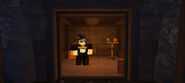 Player inside the Mines elevator in the Lobby.
